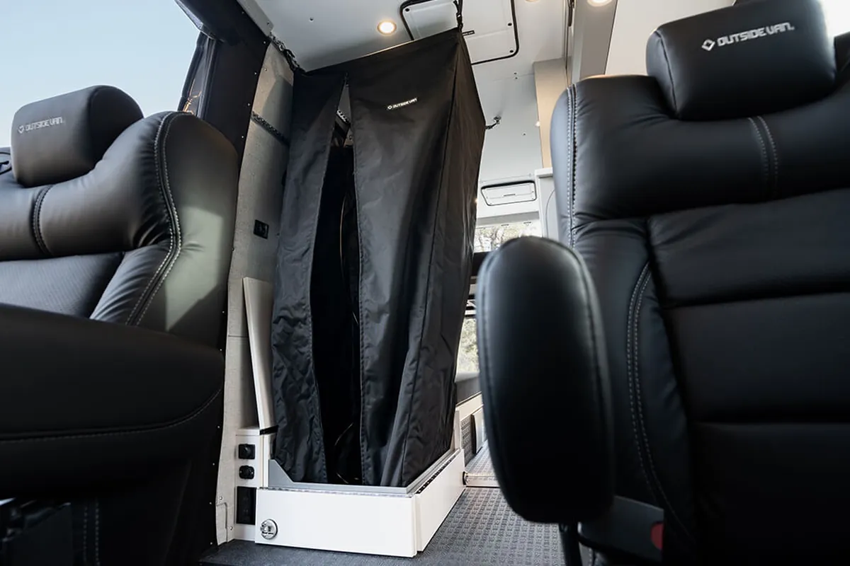 OutsideVan_Approach_InteriorHighlight_CaptainsChairs